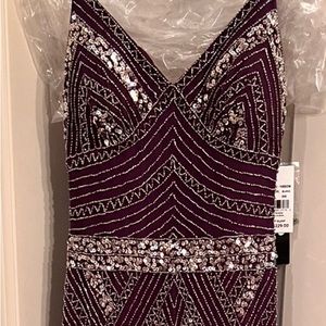 New with tags burgundy prom dress with silver accents